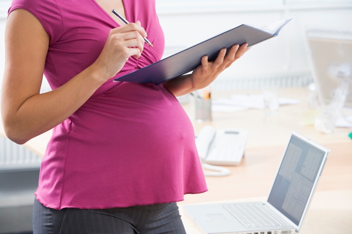 Picture of pregnant woman at work